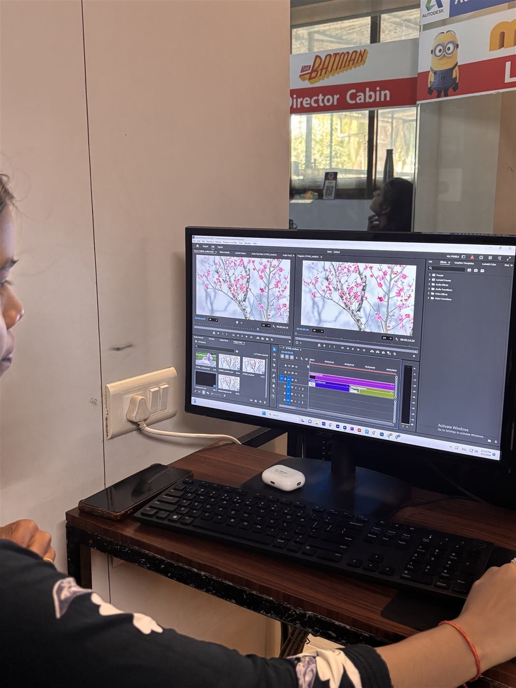 Dual-monitor Premiere Pro workspace during a lab session